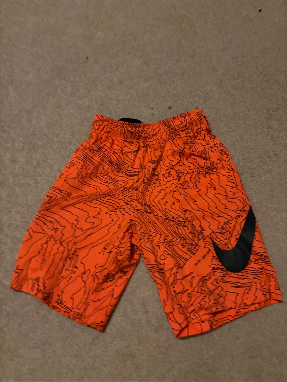 Nike Orange Patterned Athletic Shorts with Black Swoosh
